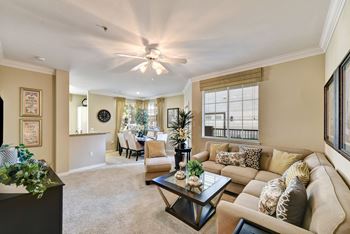 Living room with a ceiling fan at The Missions at Rio Vista, San Diego, CA, 92108